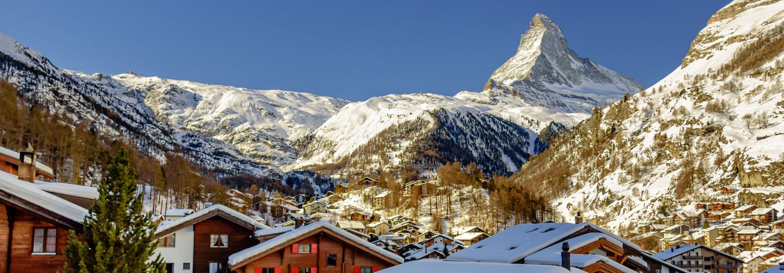 Overhead shot of the snowy town of Zermatt with the iconic Matterhorn mountain in the background