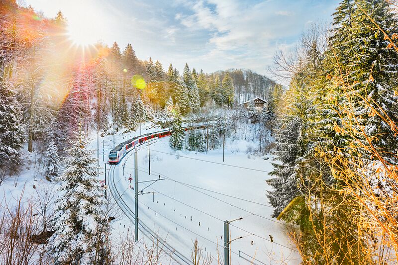 Luzern-Interlaken Express train travelling through the snow