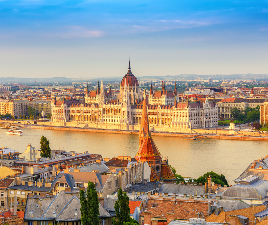 Budapest's Parliament Building stands proudly in the sunlight on a Eastern Europe rail holiday