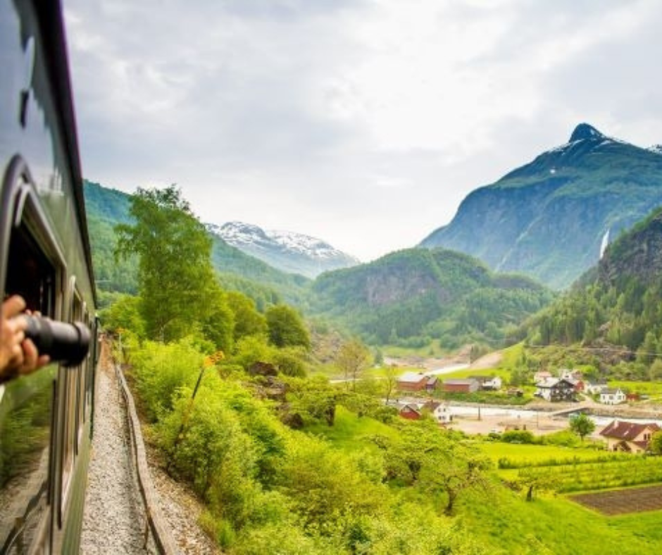 Person looking out of the window on a Norway train holiday