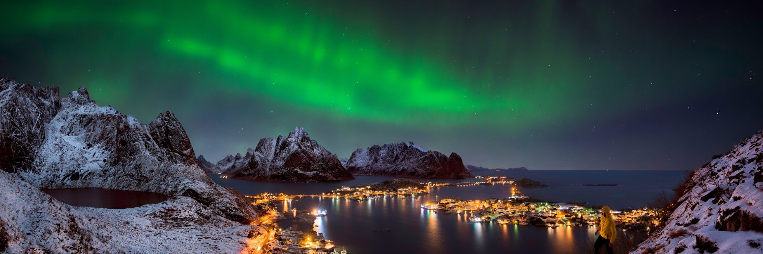 Northern lights appearing over the mountains