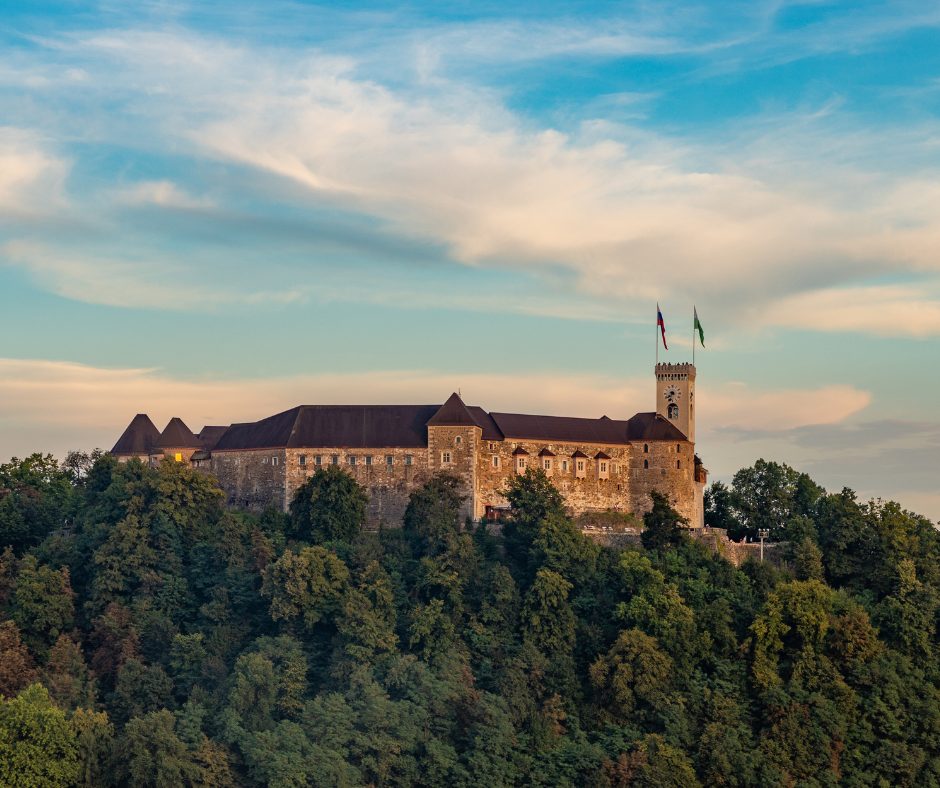 The castle turrets emerge gracefully from the tree peaks, and can be spotted while on your Slovenia rail journey